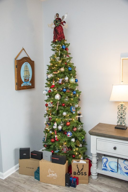 Stephen Freeman’s bedroom tree is packed with gifts at the base and a beautiful angel atop.